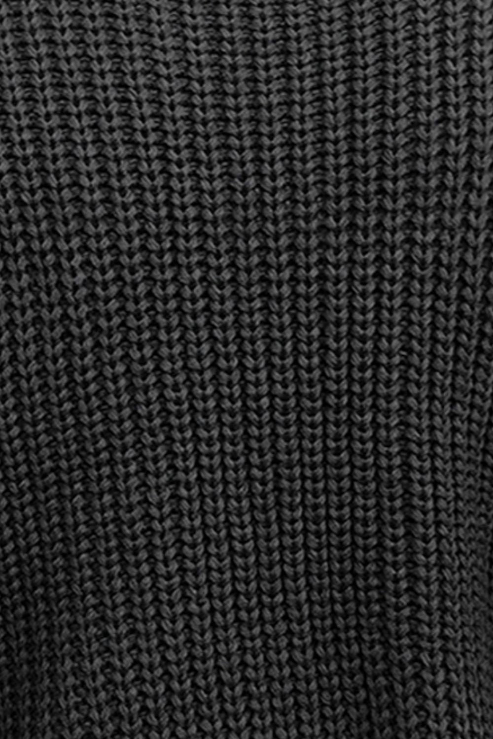 Black cable knit sleeveless mock neck sweater texture detail