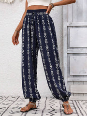 Dark Blue Indigo Leaf Print Gathered Ankle Trousers with drawstring waist and elastic cuffs.