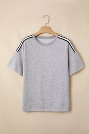 Grey relaxed t-shirt with black and white shoulder stripes, short sleeves, and crew neck.