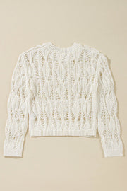 Ivory open-knit crochet crop sweater with a diamond pattern and crew neck.