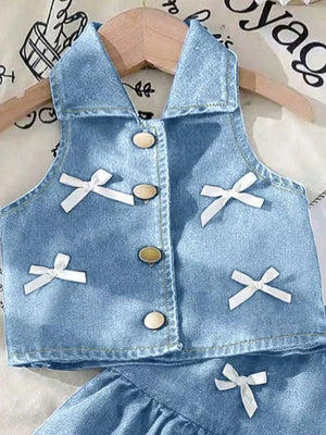 Light blue denim halter vest with white bow accents and gold buttons.