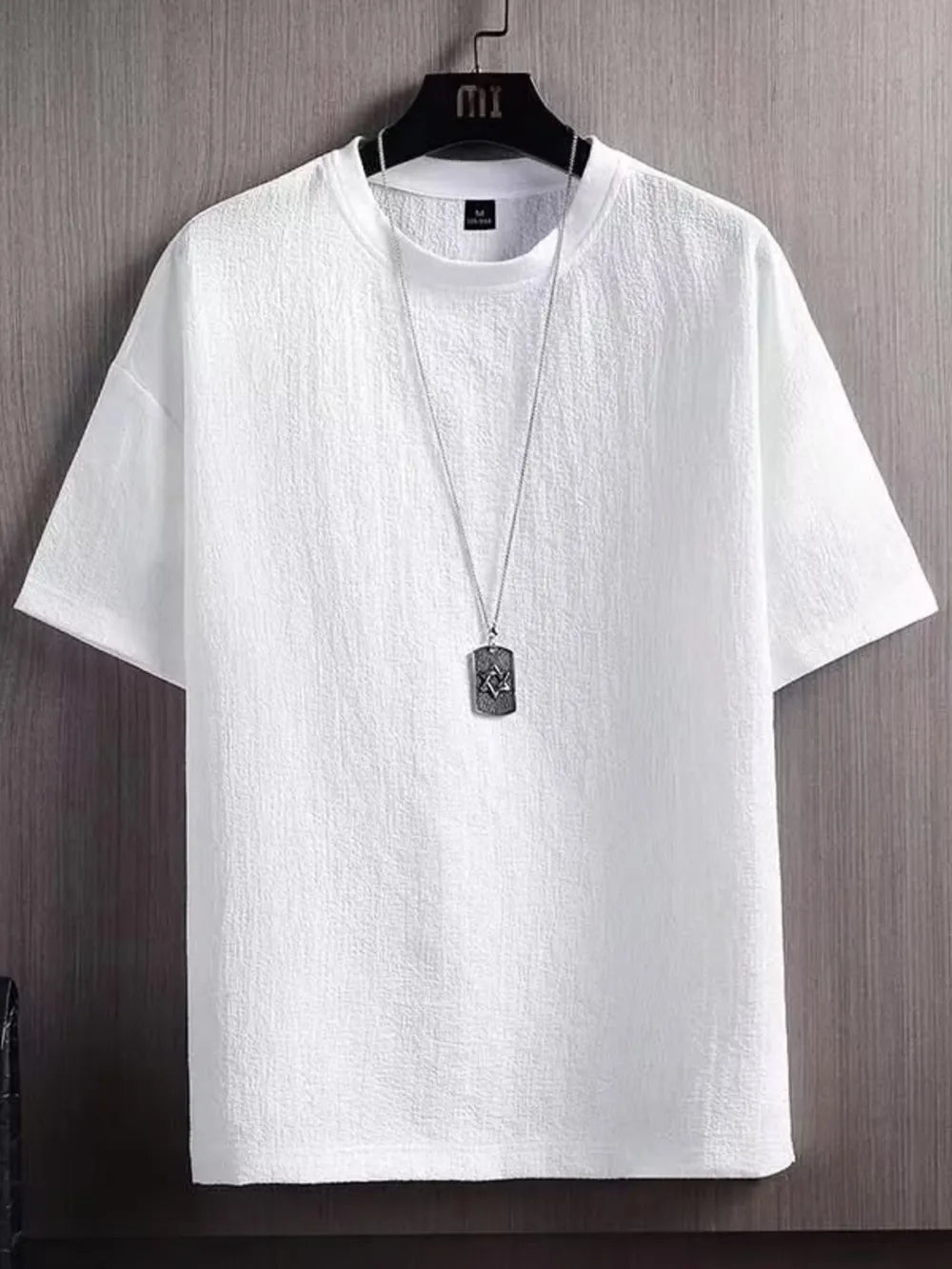 White textured round neck t-shirt for men with short sleeves and a subtle crinkle fabric detail.