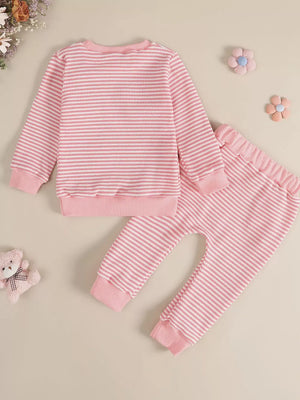 Pink and white striped baby set with bow accents on pants
