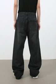Black wide leg denim jeans with a relaxed fit and classic five-pocket styling.