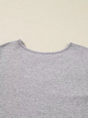 Gray ribbed knit long-sleeve top with delicate lace trim at the neckline.