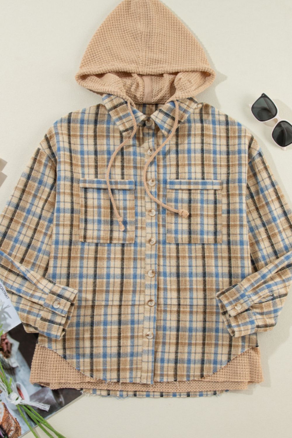 Textured plaid hooded overshirt with raw hem and drawstring hood.