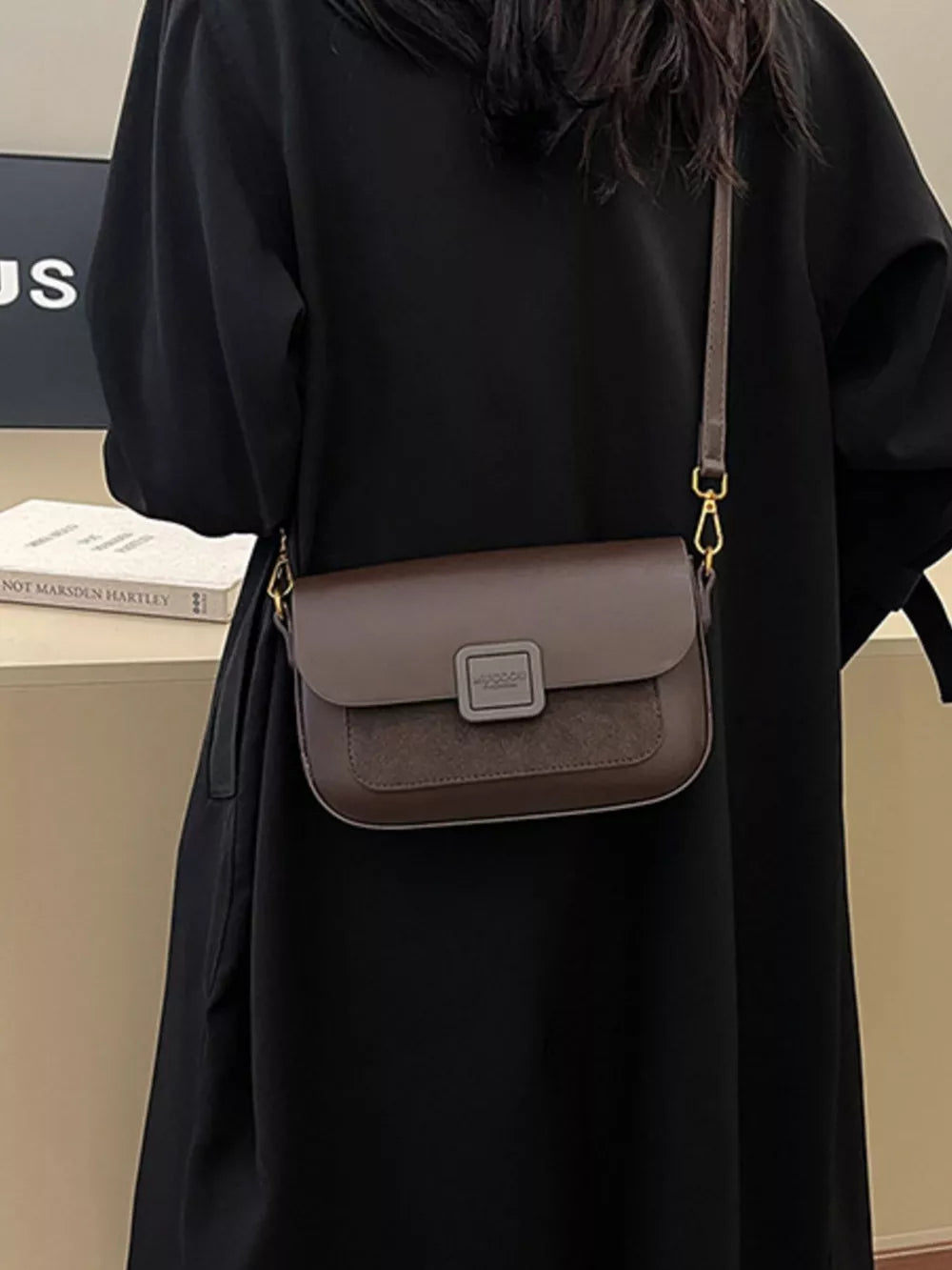 Chic two-tone crossbody bag in coffee with suede panel and gold hardware.