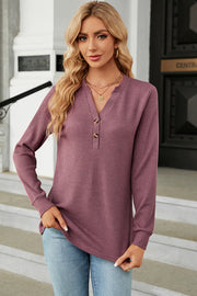 Waffle knit henley shirt in mauve with button placket and long sleeves.