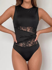 Black sleeveless bodysuit with sheer lace panels and a twisted detail.