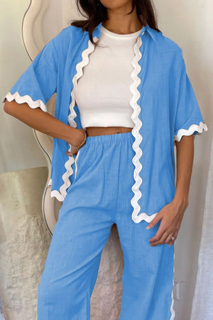 Sky blue co-ord set with scalloped trim shirt and pants, worn with white crop top.