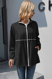 Black hooded rain jacket with white zipper and trim, full zip, long sleeves, pockets.