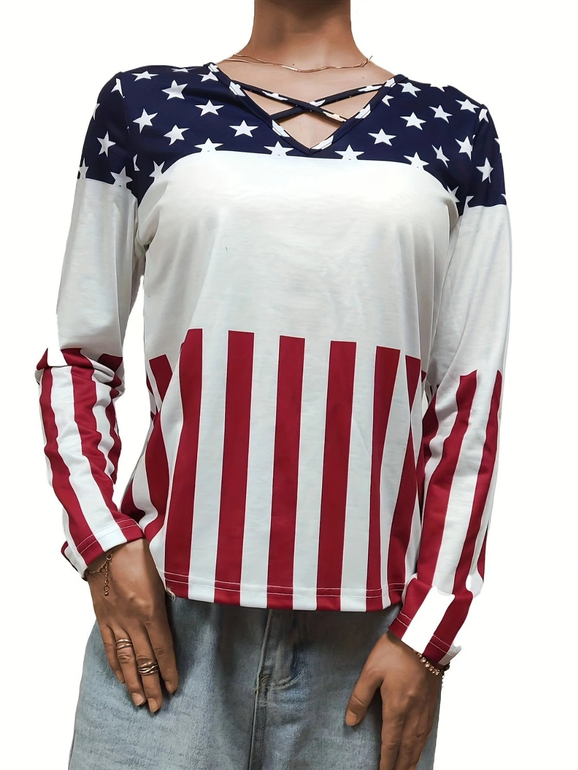 Long sleeve top with crisscross neckline and American flag print.