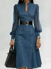 Denim midi dress with sheer puff sleeves, V-neck, and black belt.
