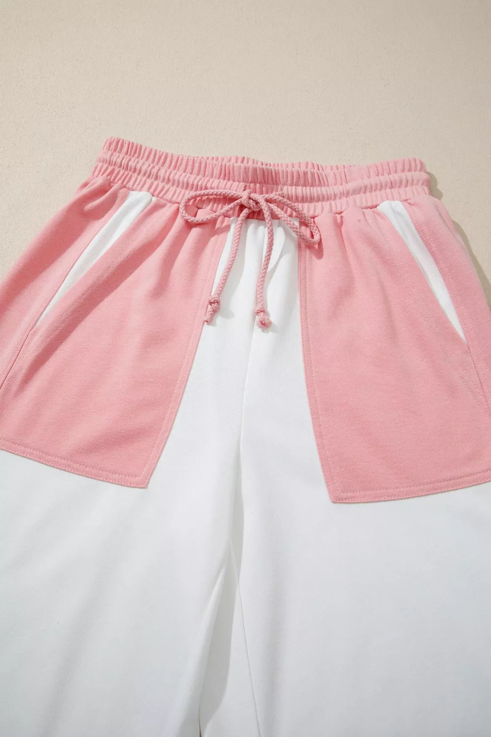 Color block cotton lounge set with pink and white panels and a drawstring waist.