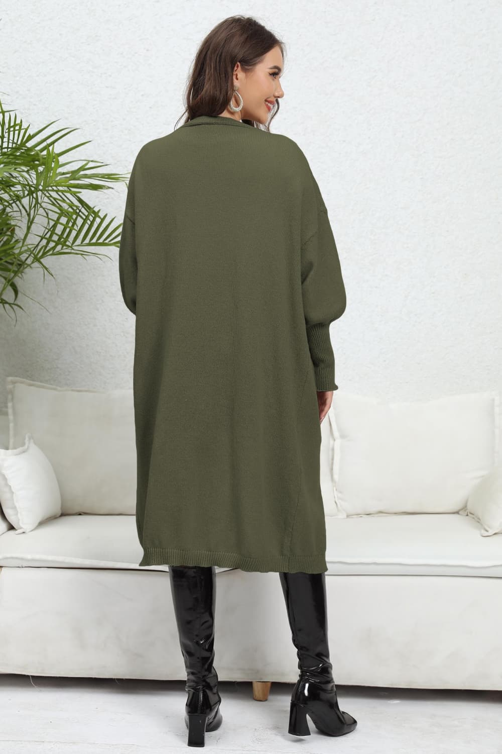 Army green long cardigan with balloon sleeves and ribbed cuffs.