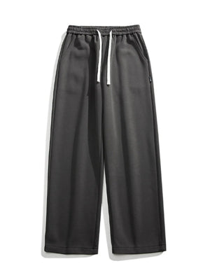 Dark gray casual loose fit sweatpants with white drawstring and pockets.