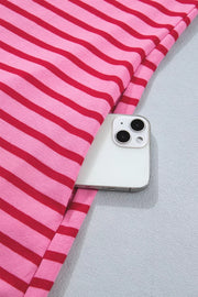 Pink and red striped maxi tee dress with scalloped trim detail, showing a phone pocket.