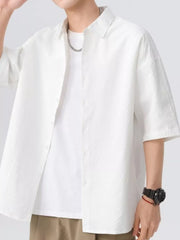 White textured short-sleeve men's shirt with button-up front and collar.