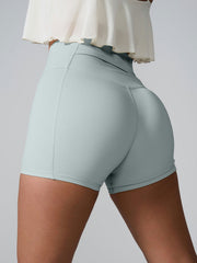 Light Green active shorts with sculpted pocket detail and seamless back.