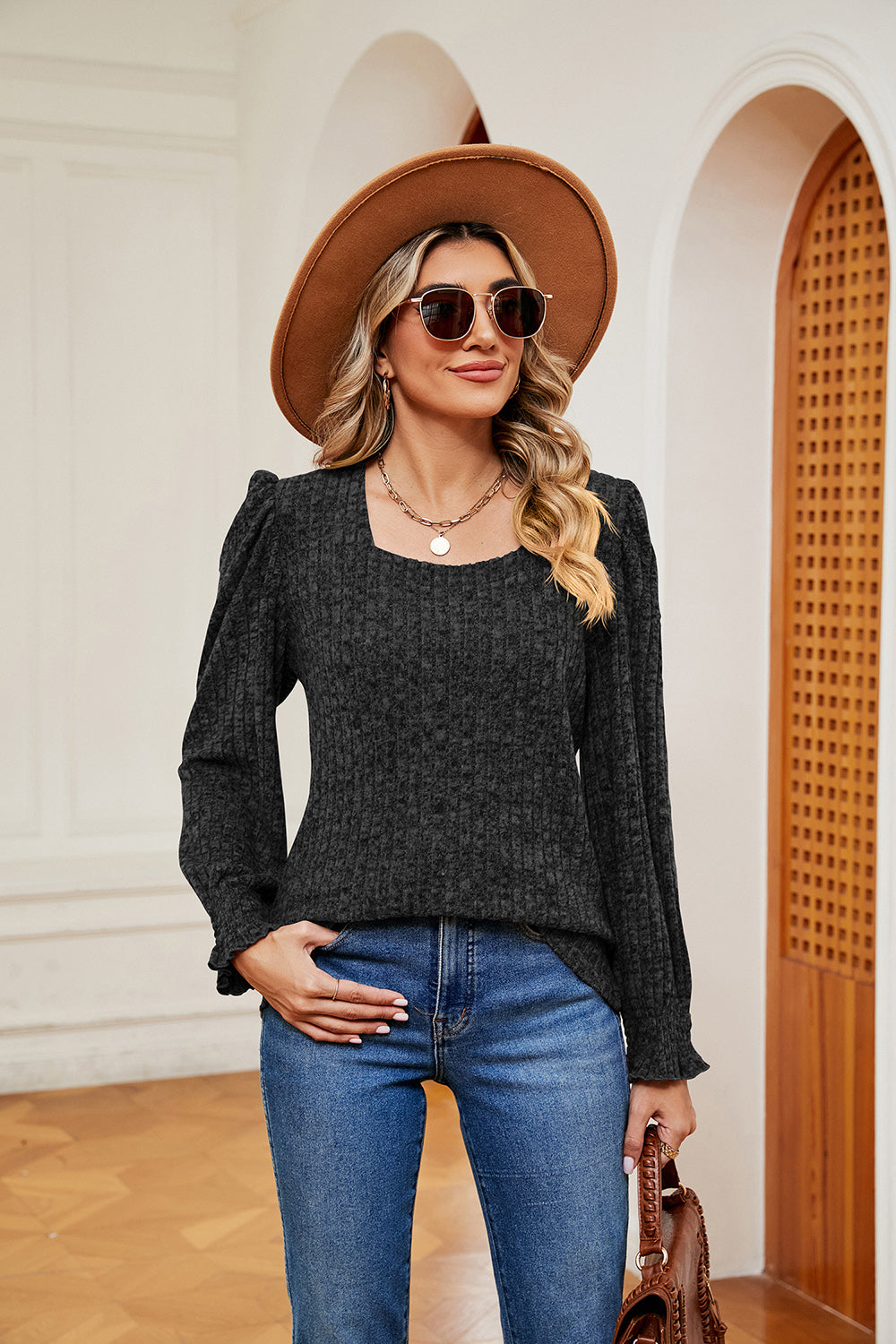 Textured dark gray knit blouse with square neckline and cuffed puff sleeves.