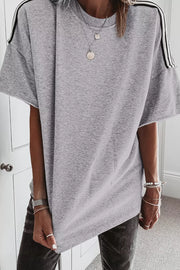 Grey relaxed fit t-shirt with black shoulder stripes, crew neck, and short sleeves.