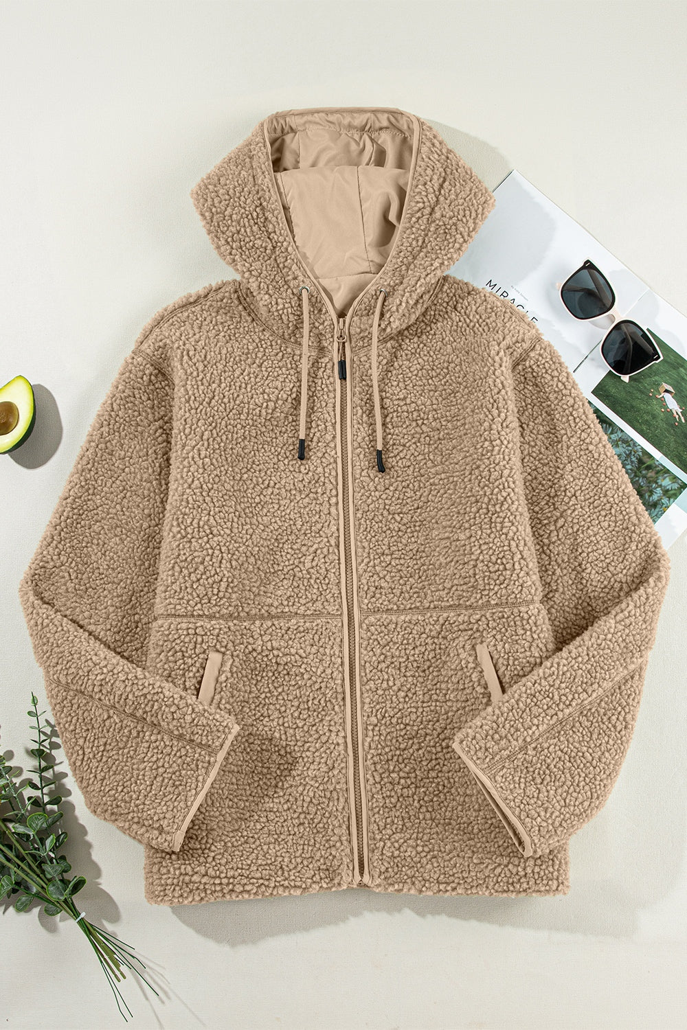 Sherpa hooded jacket in khaki with contrast lining and zip closure.
