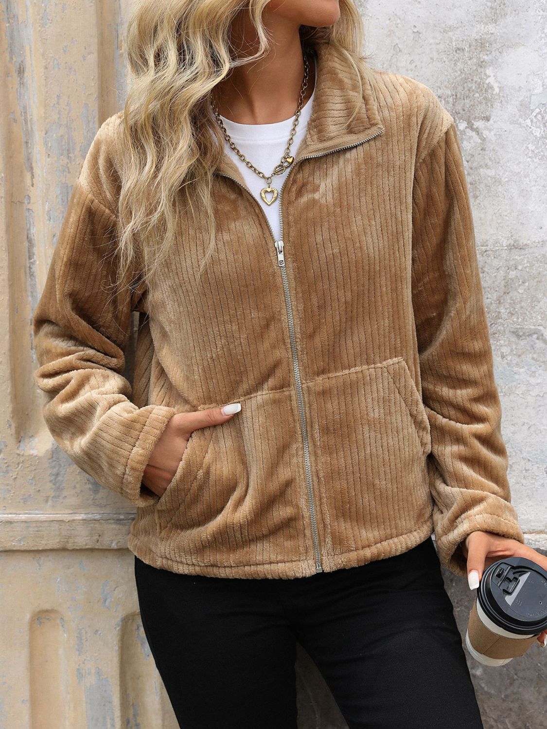 Plush camel corduroy zip-up jacket with collared neckline and crochet detail.