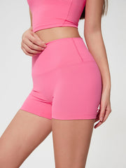 Nova Rise high-waisted active shorts in Fuchsia Pink, with a seamless waistband and short length.