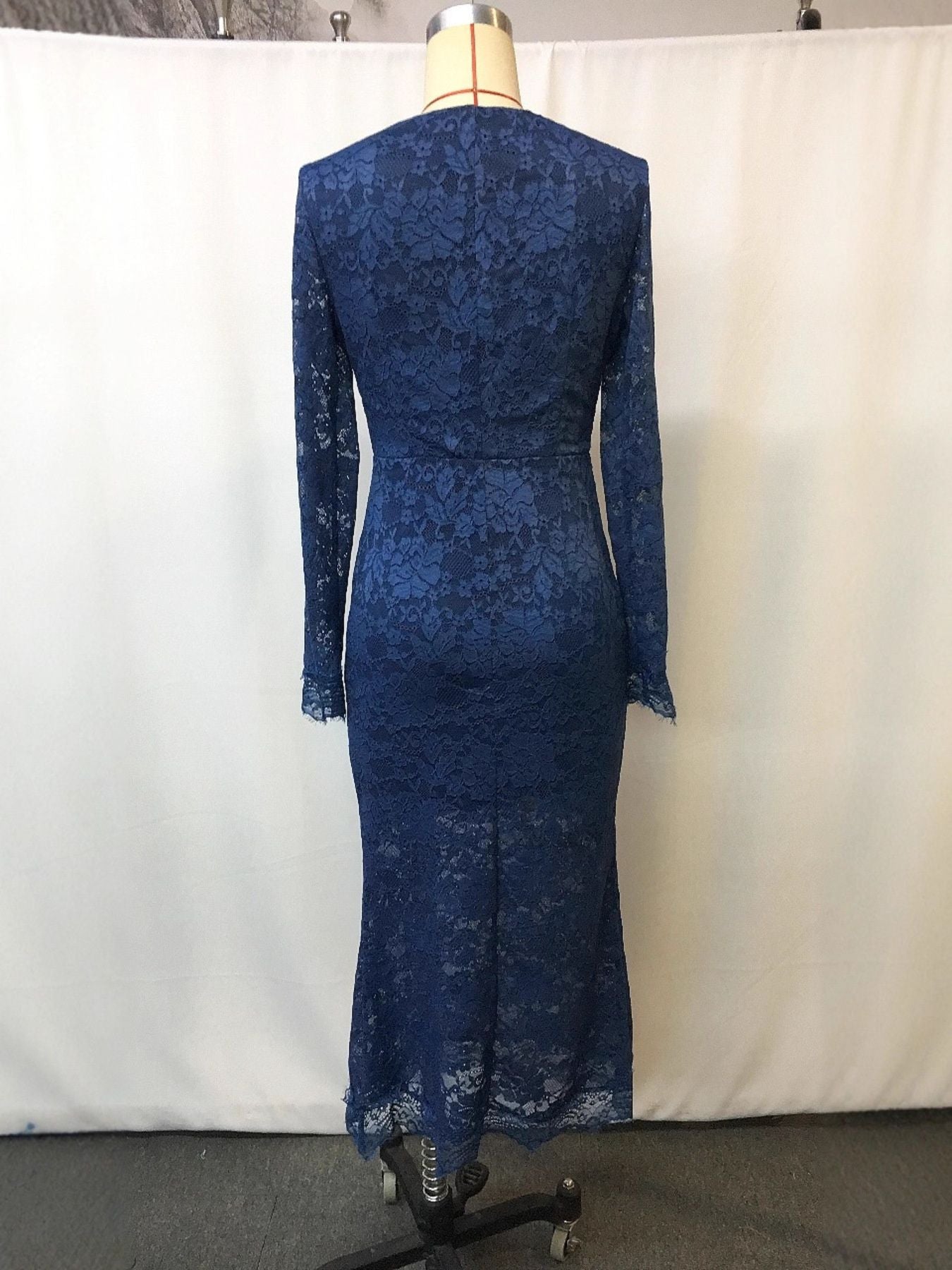 Navy blue lace long sleeve midi dress with a mermaid hem.
