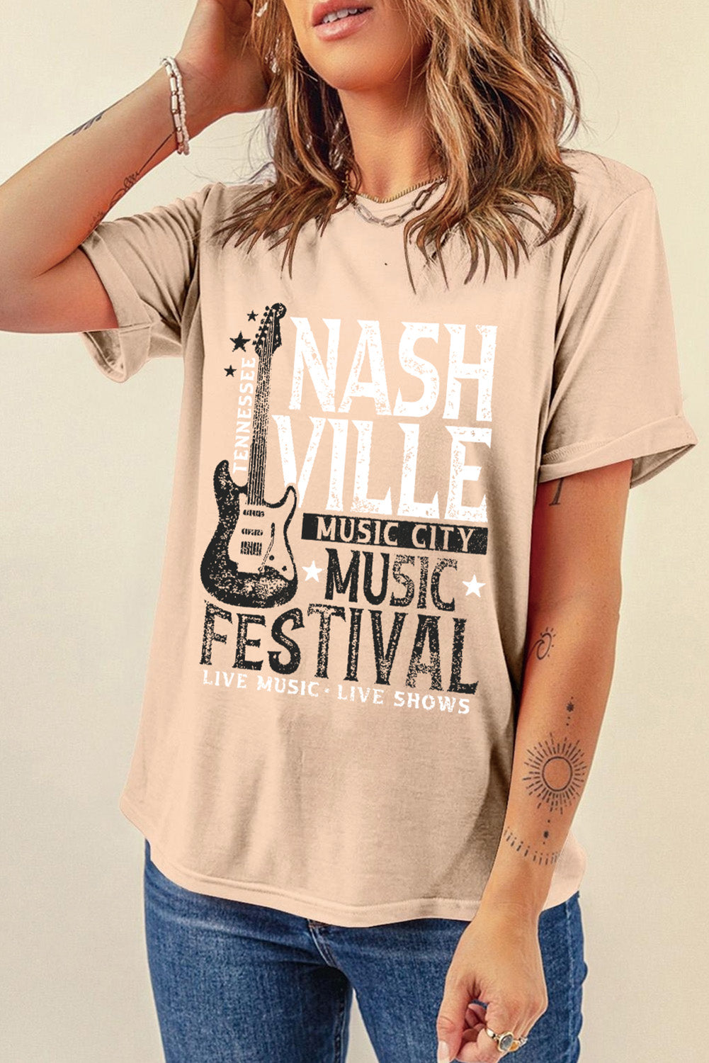 Tan graphic t-shirt with Nashville Music Festival print and guitar detail.