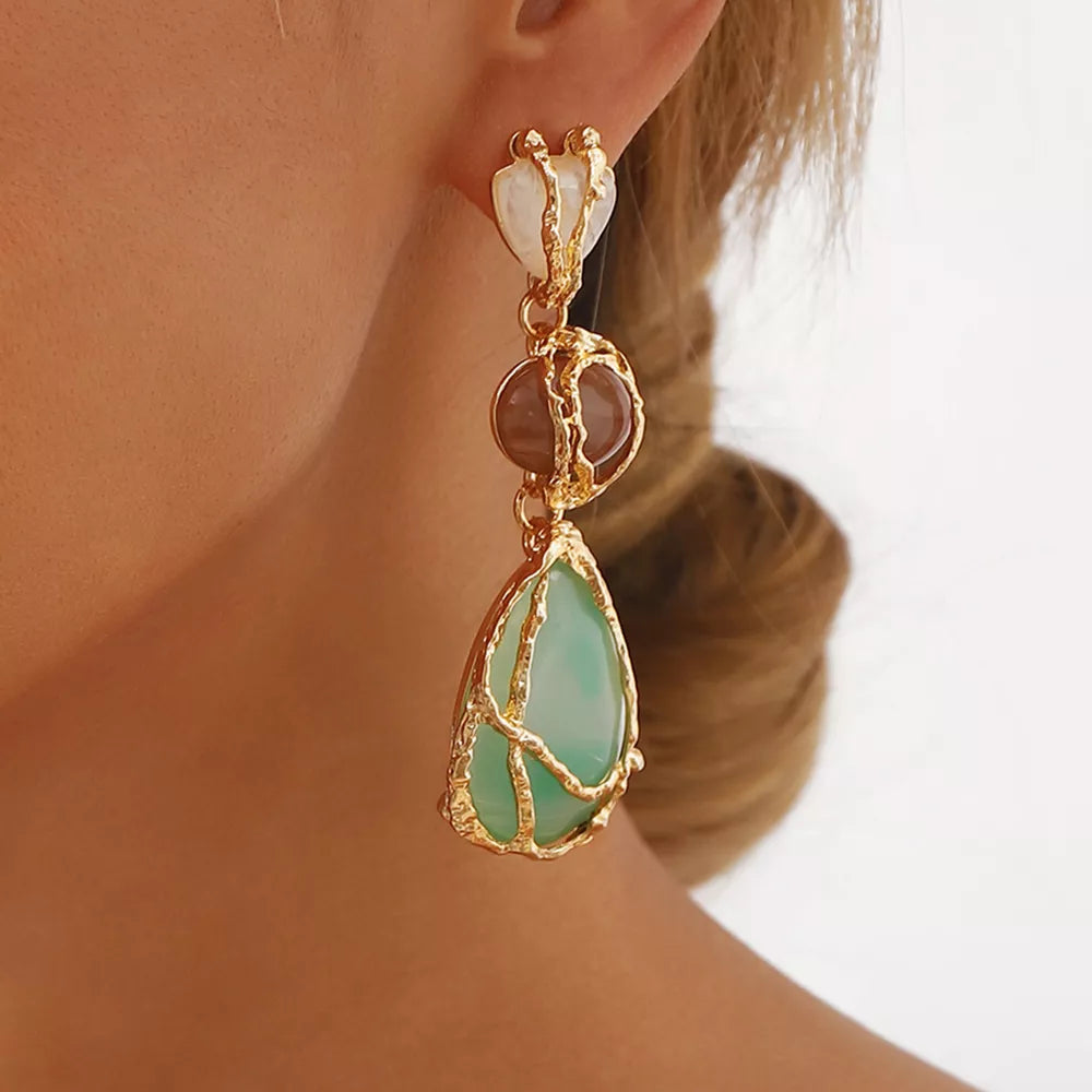 Gold-plated teardrop dangle earrings with green and brown stones and white accents.