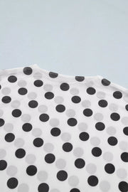 White polka dot mesh mock neck maternity shirt with sheer fabric.