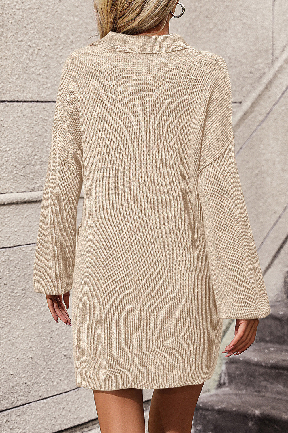 Beige ribbed knit polo dress with pockets and long sleeves.
