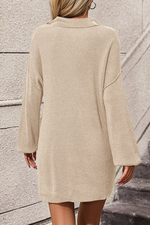 Beige ribbed knit polo dress with pockets and long sleeves.