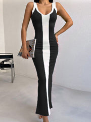 Black and white contrast panel bodycon maxi dress with scoop neck and sleeveless design.