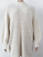 Cream ribbed knit cocoon turtleneck dress with long sleeves and a relaxed fit.