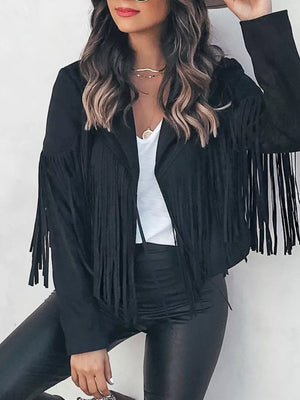 Black fringe open front cropped jacket with a white top and black pants.