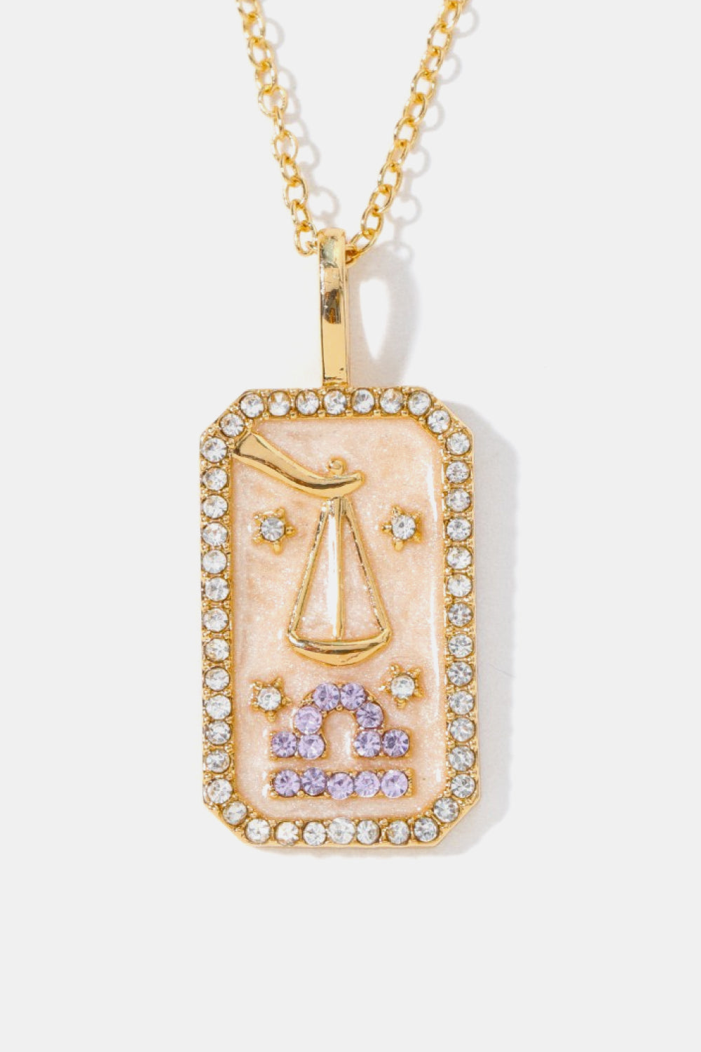 14K gold-plated Libra zodiac sign crystal pendant necklace with pink enamel and clear crystals.