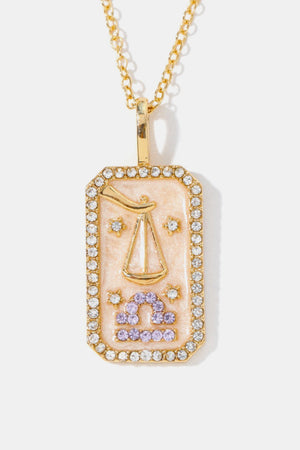 14K gold-plated Libra zodiac sign crystal pendant necklace with pink enamel and clear crystals.