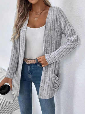 Light gray ribbed knit cardigan with drape front and ruched pockets.