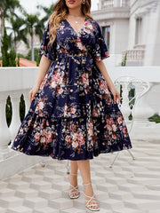 Midnight Bloom floral midi dress with flutter sleeves and tiered hem