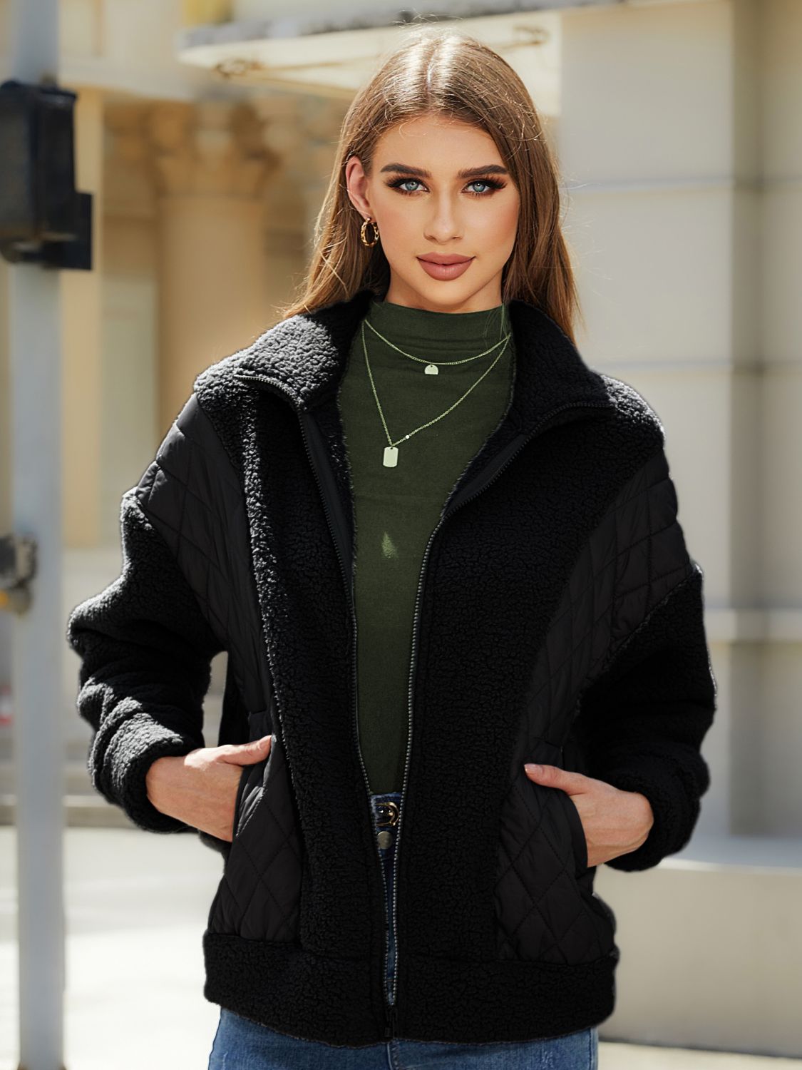 Black quilted & sherpa panel zip jacket with stand-up collar and pockets.