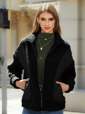 Black quilted & sherpa panel zip jacket with stand-up collar and pockets.