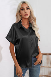 Black satin button-down blouse with cuffed short sleeves and a collared neckline.