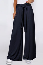 Dark Navy wide-leg flow pants with self-tie waist and pockets.