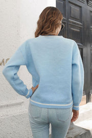 Light blue acrylic knit sweater with white striped cuffs and hem.