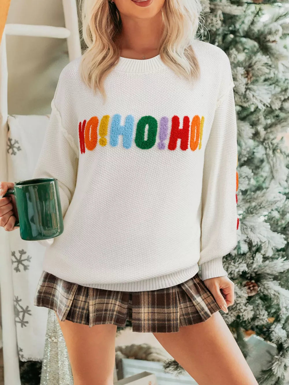 White chenille holiday sweater with colorful HO HO HO graphic, crew neck, and chunky knit.