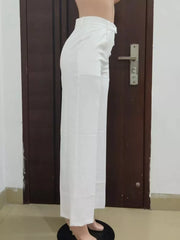 Ivory white high-waisted wide-leg trousers with a clean, tailored look.