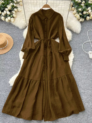 Textured tiered long sleeve button-down dress in Olive Brown with a belted waist.