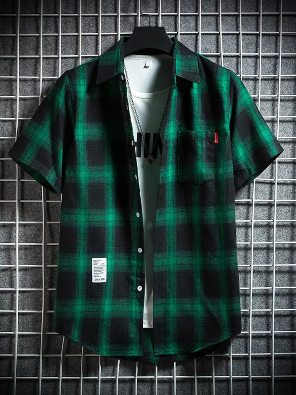Green plaid short-sleeve cotton button-down shirt with chest pocket.
